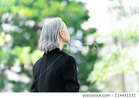 Senior woman in mourning clothes, hair care, gray hair Senior woman in mourning clothes, hair care, gray hair 114431172