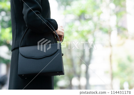 Senior woman in mourning clothes, hands Senior woman in mourning clothes, hands 114431178