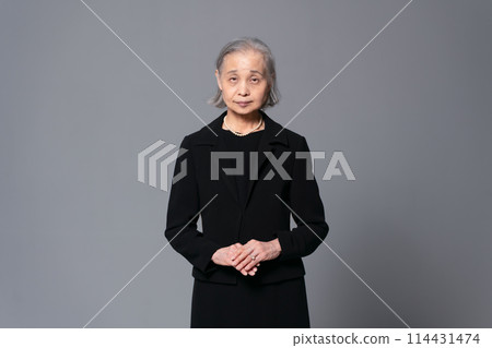 Portrait of a senior woman in mourning clothes 114431474
