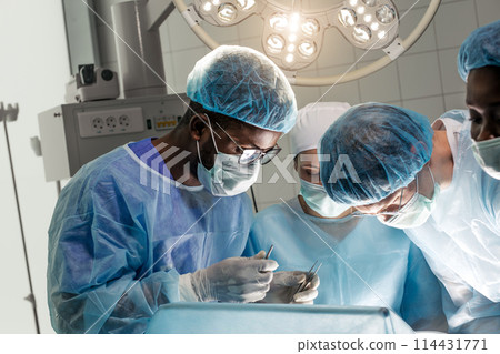 multiracial doctors appling first aid 114431771