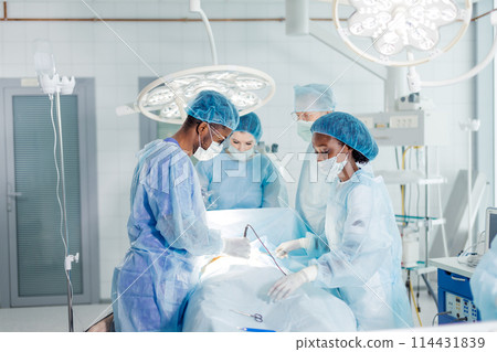 people in masks remove or repair a part of the body. 114431839