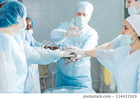 friendly doctors shows their frindship. surgeons express their common goal 114431929
