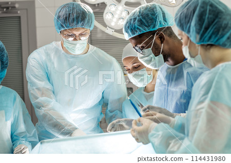 young interns watching the experiment 114431980