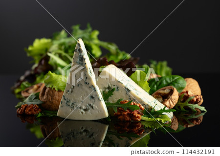Blue cheese with walnuts and fresh greens. Blue cheese with walnuts and fresh greens. 114432191