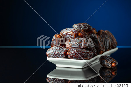 Dates on a black reflective background. Dates on a black reflective background. 114432195