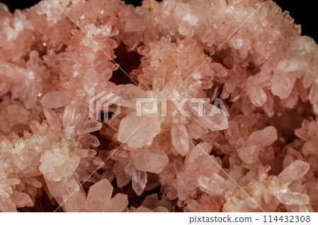 Macro stone mineral pink quartz amethyst on a black background 114432308