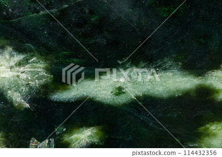 Macro stone Nephrite mineral on white background Macro stone Nephrite mineral on white background 114432356