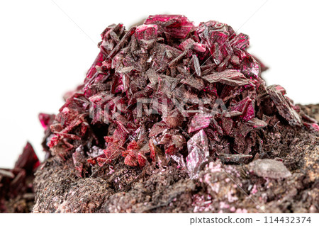 Macro stone Erythrite mineral on white background Macro stone Erythrite mineral on white background 114432374