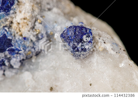 Macro of mineral stone Lazurite on a black background Macro of mineral stone Lazurite on a black background 114432386