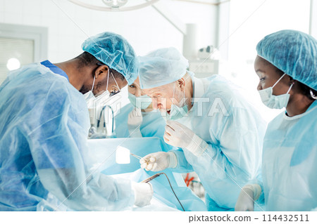 puzzled nervous surgon has forgotton scissors into the client's body puzzled nervous surgon has forgotton scissors into the client's body 114432511