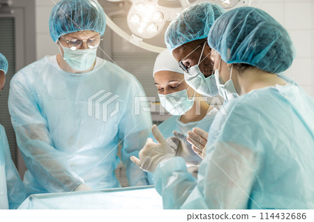 doctors and nurses providing treatment through an opening in the body. doctors and nurses providing treatment through an opening in the body. 114432686