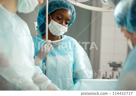 good looking awesome nurse enjoying her job good looking awesome nurse enjoying her job 114432717