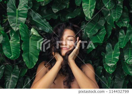 Natural Hair Care Portrait of Young Woman in Exotic Tropical Foliage Natural Hair Care Portrait of Young Woman in Exotic Tropical Foliage 114432799