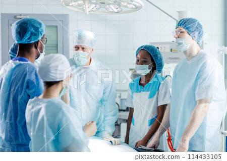 skilled experienced doctor teaching interns skilled experienced doctor teaching interns 114433105