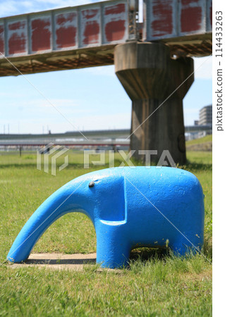 Iron bridge and playground equipment on the riverbed 114433263