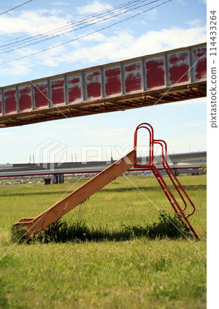 Iron bridge and playground equipment on the riverbed Iron bridge and playground equipment on the riverbed 114433264