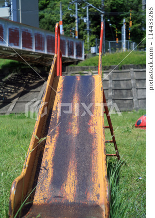 Iron bridge and playground equipment on the riverbed 114433266