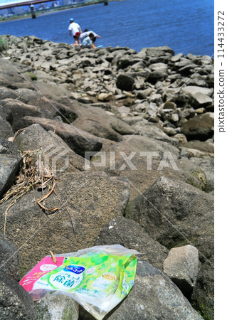 Garbage on the river bank 114433272