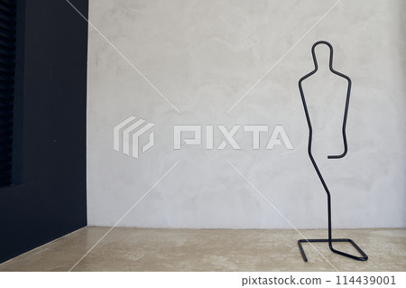 A stand holder for jewelry. A jewelry stand in the shape of a human silhouette. With space to copy, with space for your design, poster. High quality photo A stand holder for jewelry. A jewelry stand in the shape of a human silhouette. With space to copy, with space for your design, poster. High quality photo 114439001