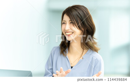 Businesswoman speaking with a smile Businesswoman speaking with a smile 114439884
