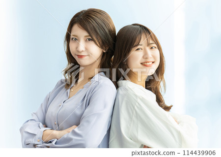 Two friendly businesswomen, teamwork image Two friendly businesswomen, teamwork image 114439906