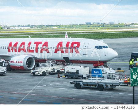 Airplane from Air Malta being in parking position to take cargo and passengers. Air Malta plc is the flag carrier airline of the Maltese Islands 114440136