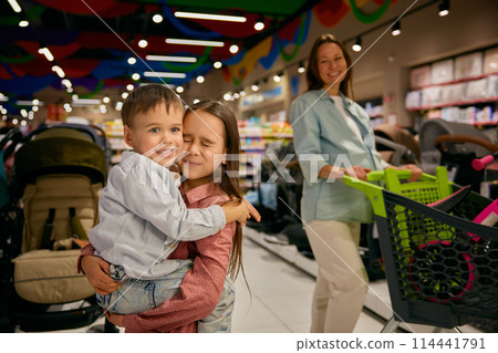 Happy family in shopping mall portrait with adorable children 114441791
