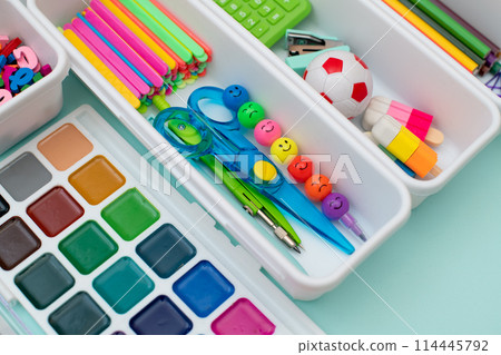 School supplies.Concept back to school. colored stationery is arranged in white organizers. Creative Drawer Organizing. Storage office supplies School supplies.Concept back to school. colored stationery is arranged in white organizers. Creative Drawer Organizing. Storage office supplies 114445792