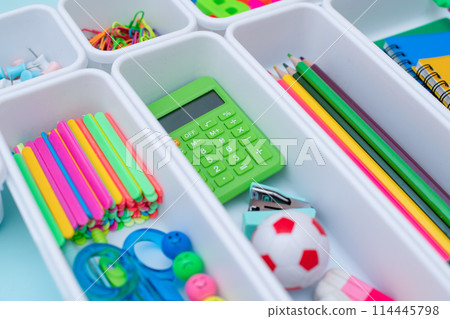 School supplies.Concept back to school. colored stationery is arranged in white organizers. Creative Drawer Organizing. Storage office supplies 114445798