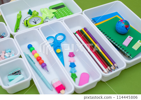 School supplies.Concept back to school. colored stationery is arranged in white organizers. Creative Drawer Organizing. Storage office supplies 114445806