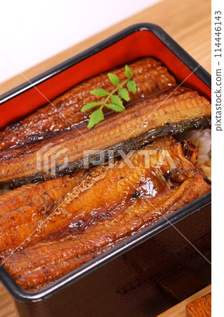 Grilled eel served in a tiered box Grilled eel served in a tiered box 114446143