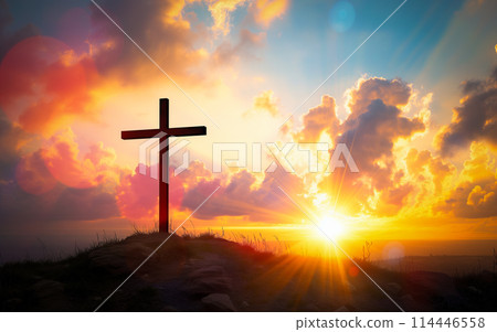 Easter concept cross on Golgotha Calvary hill against a dramatic sunset 114446558