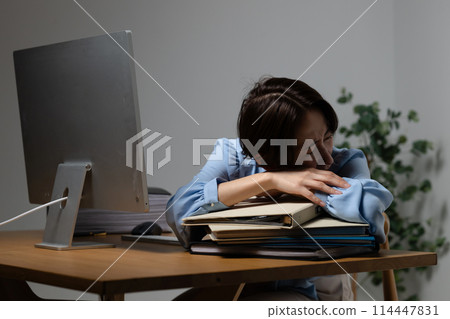 Tired woman in front of computer 114447831