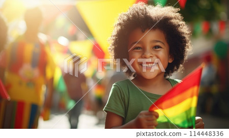 Happy Child Holding red, green and yellow flag symbolizing Juneteenth Freedom and African liberation day. Black life matters. Black history month. 114448336