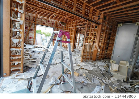 A house undergoing demolition work for reconstruction 114449800