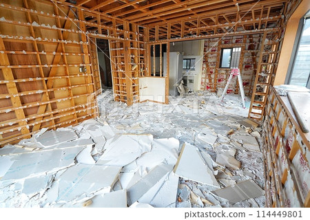 A house undergoing demolition work for reconstruction 114449801