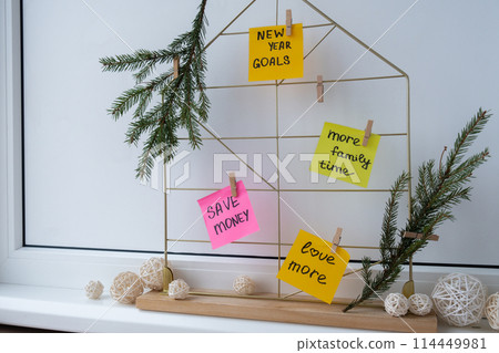 Action board new year's resolutions on colorful sticky notes. Making promises for new year, setting goals. Dream year Action board new year's resolutions on colorful sticky notes. Making promises for new year, setting goals. Dream year 114449981