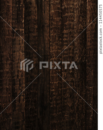 Vertical background image of a rough-hewn dark brown surface wooden wall 114450575