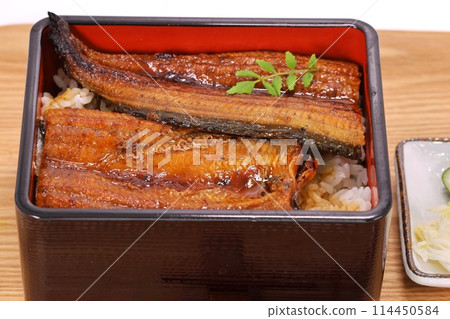 Grilled eel served in a tiered box with rice Grilled eel served in a tiered box with rice 114450584