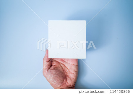 Male hand holding a square shape 114450866