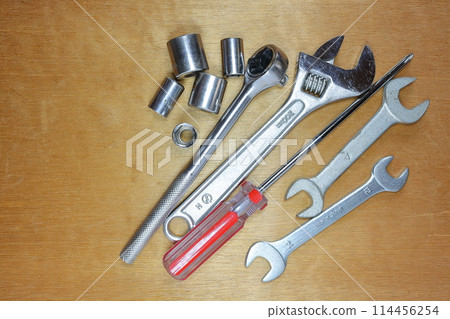tools placed on a wooden board 114456254