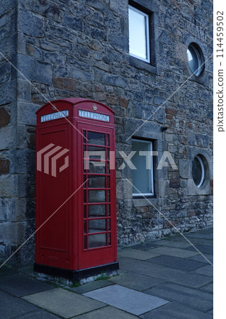 Vintage Red Telephone Box in Old European City Street 114459502