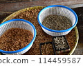 Coffee beans during peeling process 114459587