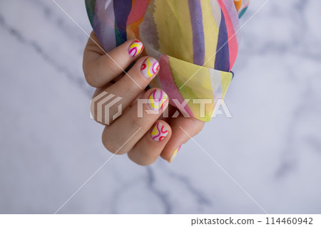 Stylish colorful summer female nails. Modern trendy stylish Beautiful manicure. Cute pastel nail minimalistic design concept of beauty treatment. Gel nails. Skin care 114460942