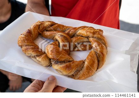 Salzburg, Austria, August 15, 2022. A delicious sweet pretzel seen up close before being eaten. Salzburg, Austria, August 15, 2022. A delicious sweet pretzel seen up close before being eaten. 114461141