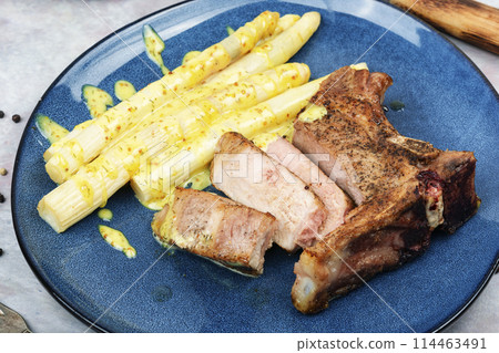 Roast meat with vegetables. 114463491