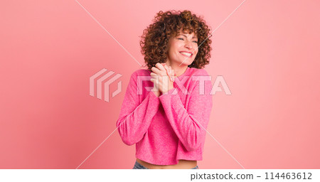 Stunned young woman on pink background Stunned young woman on pink background 114463612