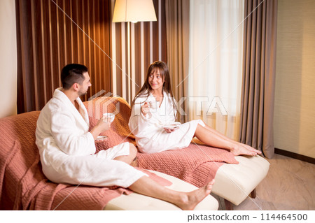 cheerful attractive girl and guy enjoying spending time in the resort 114464500
