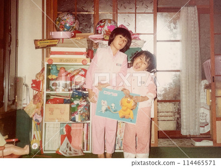Two sisters posing in a room in the 1970s Two sisters posing in a room in the 1970s 114465571