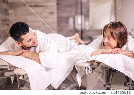 Couple enjoying spa treatments. close up photo. 114465618